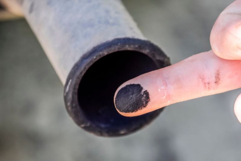 black soot from pipe