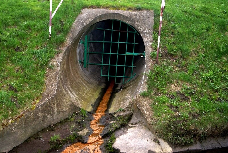 sewage coming out of pipe